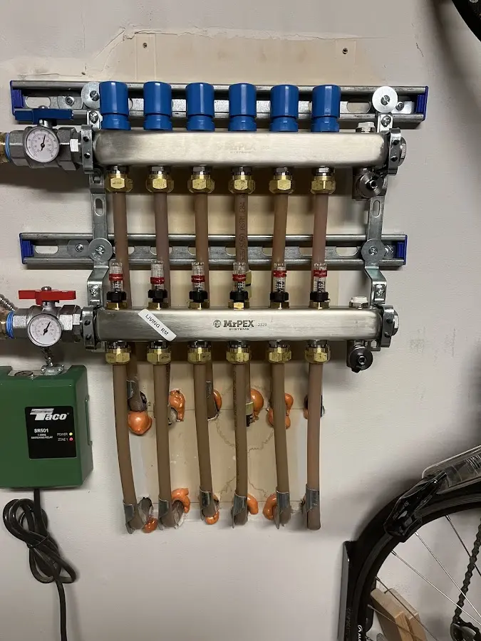 Plumber performing Water Heater Repair at a residential property in Goddard